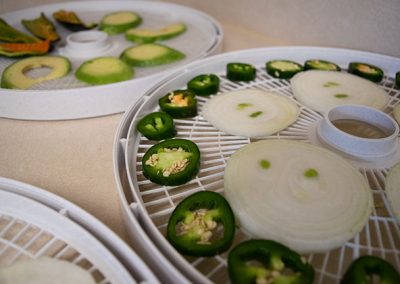 3 dehydrator trays with vegetables